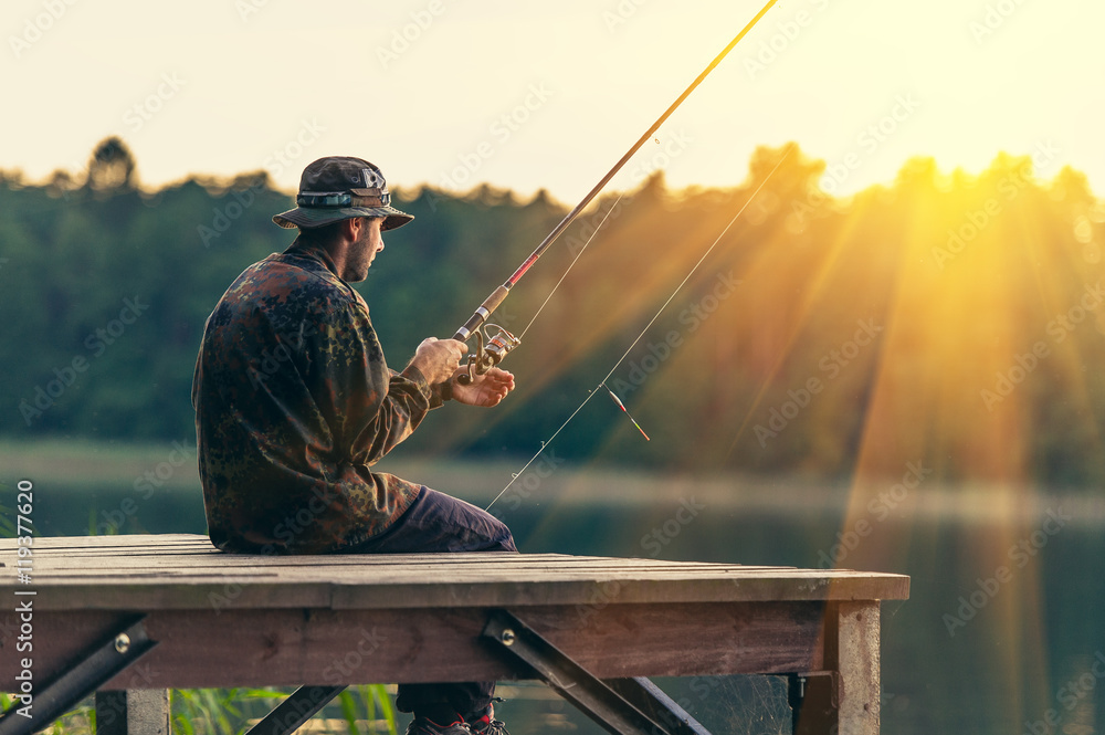 man fishes in the lakes of the Mazury man fishes in the lakes of the Mazury