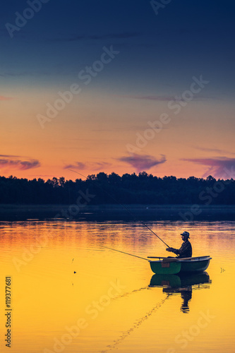 man fishes in the lakes of the Mazury
