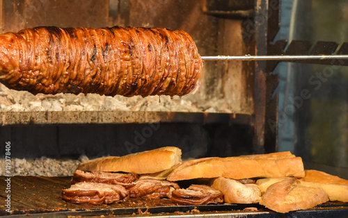 Kokorec (kokorech) roasting on the open fire. Traditional Turkish food - cooking the street food.