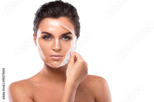 Young woman with purifying Mask on her face photo
