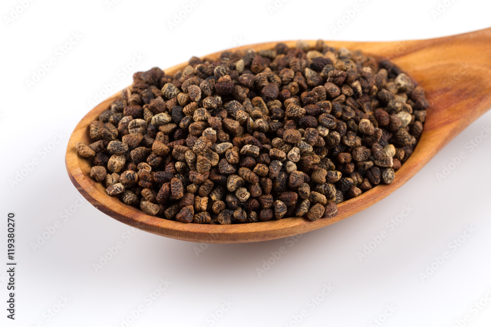 Decorticated cardamom seeds in a wooden spoon Decorticated cardamom seeds in a wooden spoon