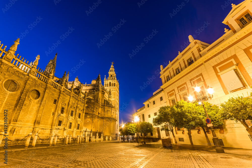 Artistic architecture of Andalusia the main square in Seville downtown, illuminated at night, in Spain