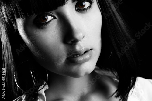 The person of the beautiful girl close up on a black background © sergey makarenko