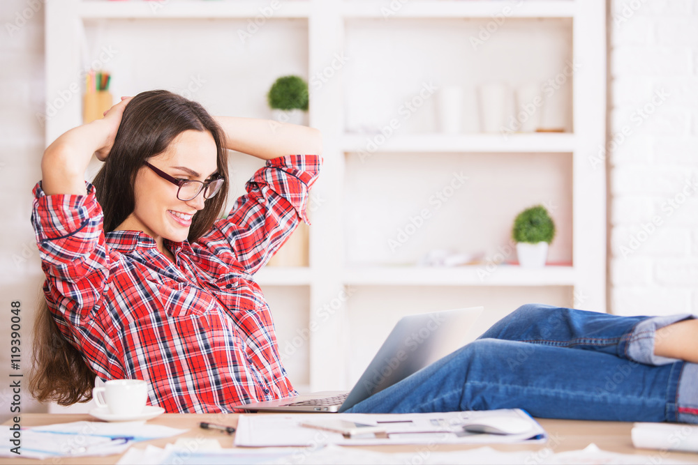 Attractive lady relaxing in office Attractive lady relaxing in office