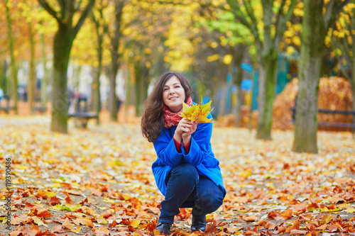 Beautiful young tourist in Paris on a fall day