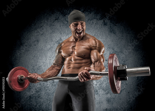 Photography Handsome power athletic man bodybuilder doing exercises with bar
