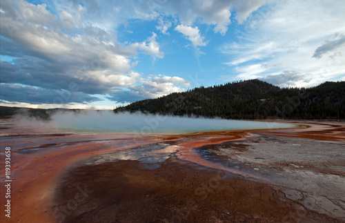 Sunset and steam at Grand Prismatic Spring along the Firehole River in Yellowstone National Park in Wyoming USA