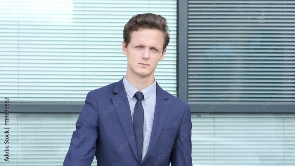 Thumbs Down Gesture by Young Businessman, Outdoor Thumbs Down Gesture by Young Businessman, Outdoor