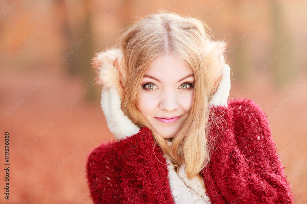 Portrait of pretty gorgeous woman in earmuffs. Portrait of pretty gorgeous woman in earmuffs.