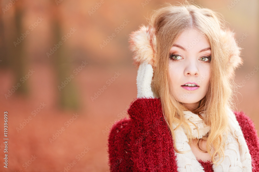 Portrait of pretty gorgeous woman in earmuffs. Portrait of pretty gorgeous woman in earmuffs.