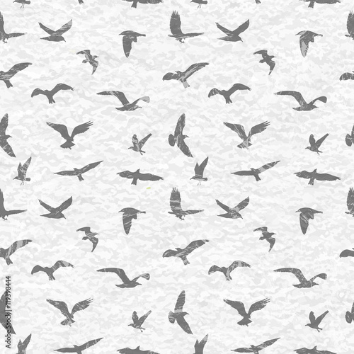 Grunge seamless pattern of flying birds white background. Vector illustration © boxerx