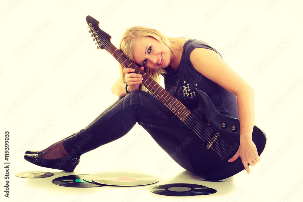 Fototapeta premium Woman with electrical guitar and vinyl record.