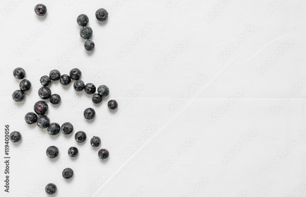 Flat lay top view of colorful blueberries against white background. Texture. Flat lay top view of colorful blueberries against white background. Texture.