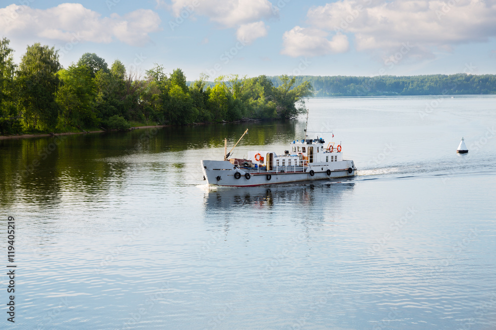 Pleasure boat moves along the Volga River