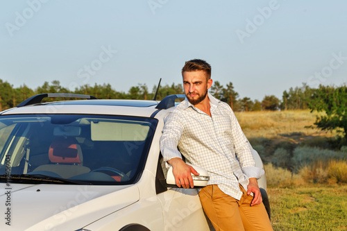 The man and his car in the steppe. © Vagengeim