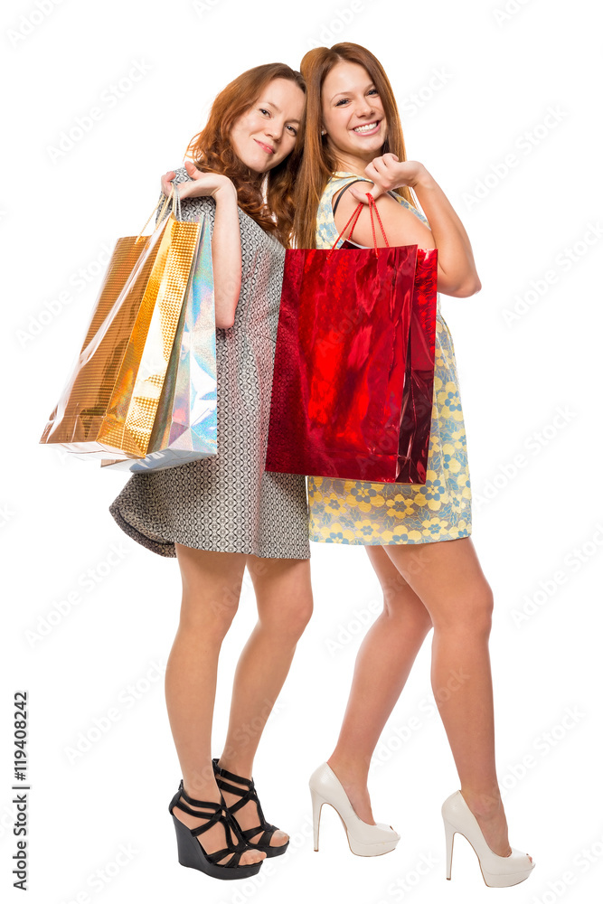 beautiful girl with shopping bags smiling, shot against a white