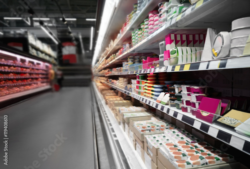 Supermarket shelves with dairy products photo