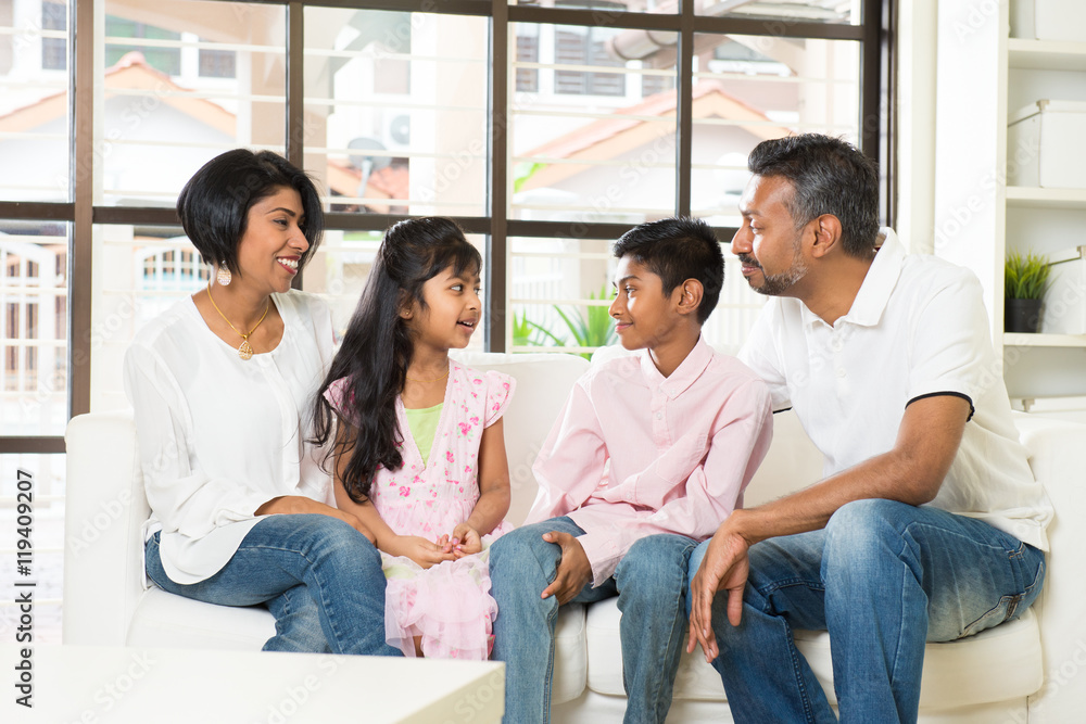 happy indian family at living room