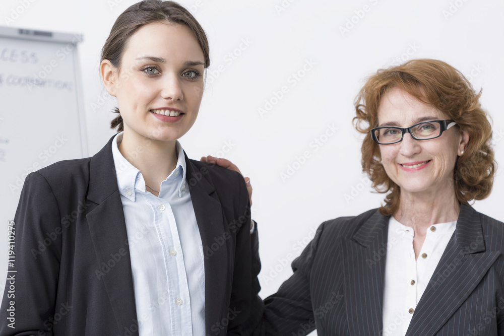 Helpful superior supporting her team member Helpful superior supporting her team member