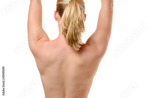 Back of a fit young woman with raised arms