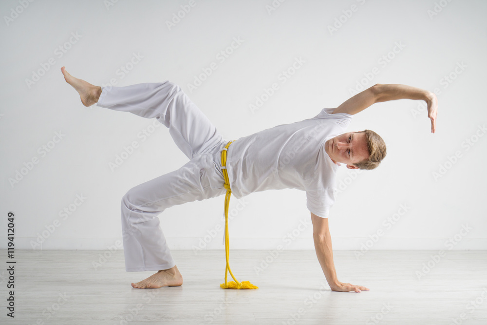 Naklejka premium Man practicing capoeira , brazilian martial art.