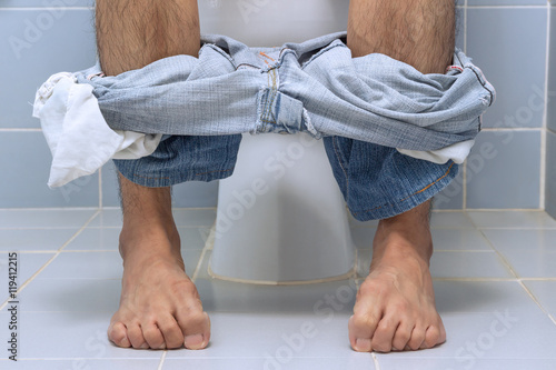 Принти на полотні Man sitting on toilet, diarrhea
