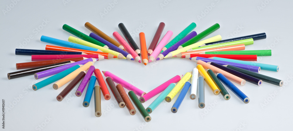 Fototapeta premium Colored pencils heart shape