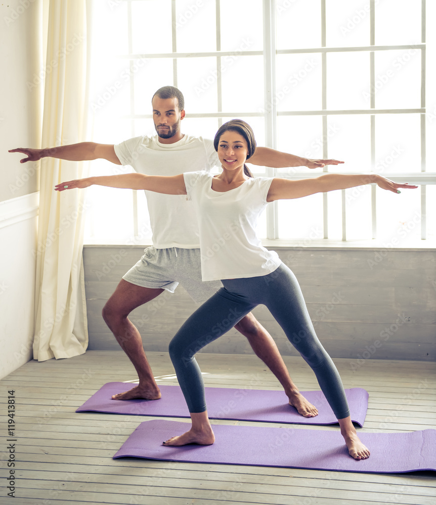 Fototapeta premium Afro American couple doing yoga