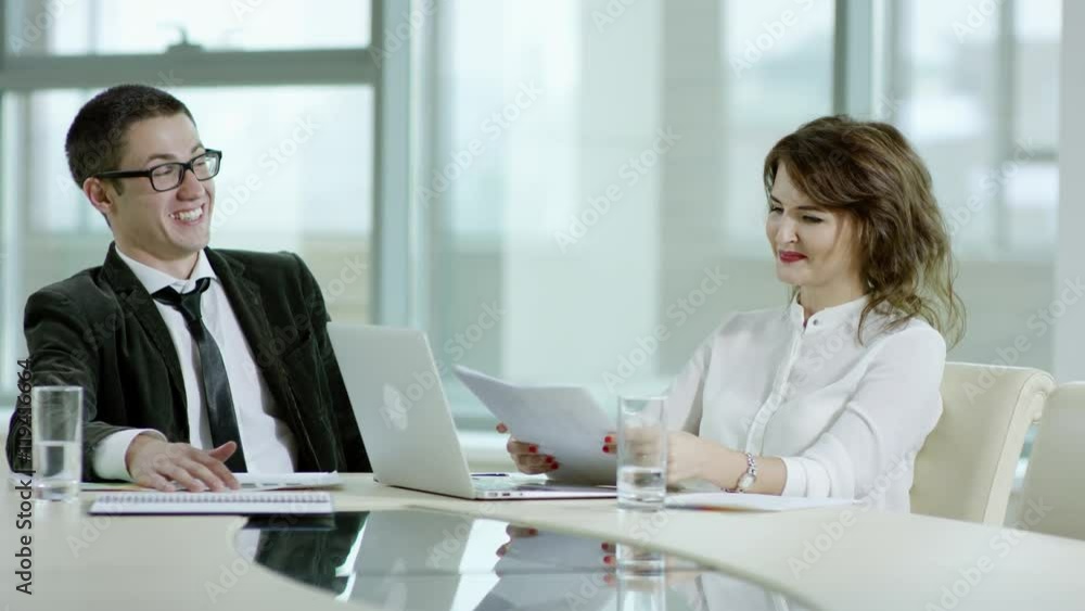 cheerful businessman and woman cheerful businessman and woman