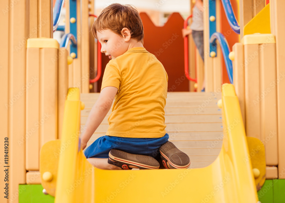 Fototapeta premium little boy on colorful playground