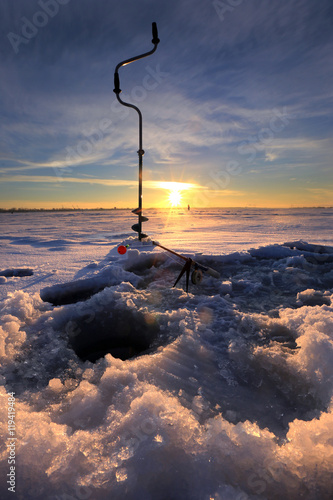 fishing gear on the river ice photo