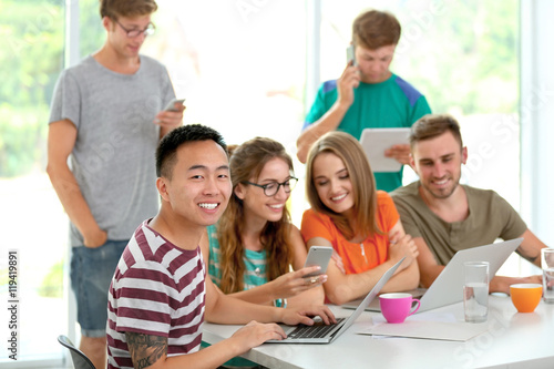 Young people with gadgets h...
