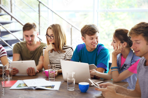 Young people with gadgets h...