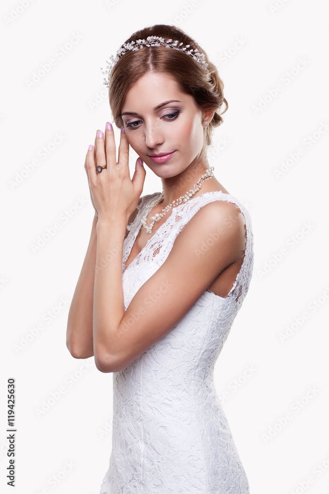 Portrait of beautiful young blonde woman bride in white Wedding