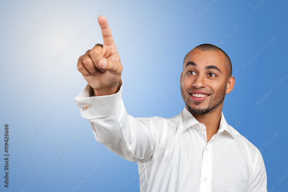 Happy successful businessman pointing on copy space Happy successful businessman pointing on copy space