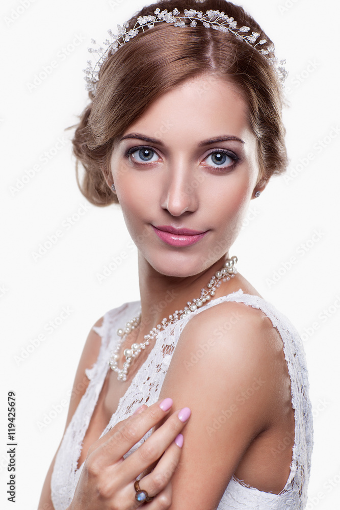 Portrait of beautiful young blonde woman bride in white Wedding