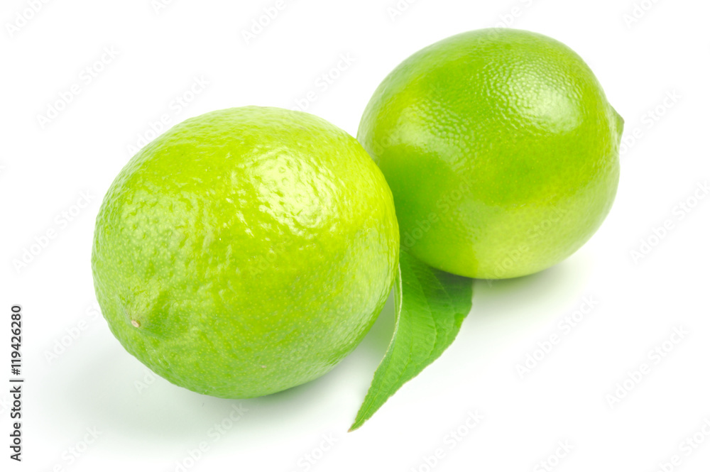Two lime with leaf isolated on white background Two lime with leaf isolated on white background