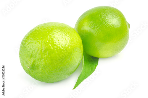 Two lime with leaf on white background