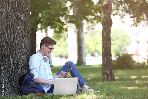 Handsome man with laptop li...