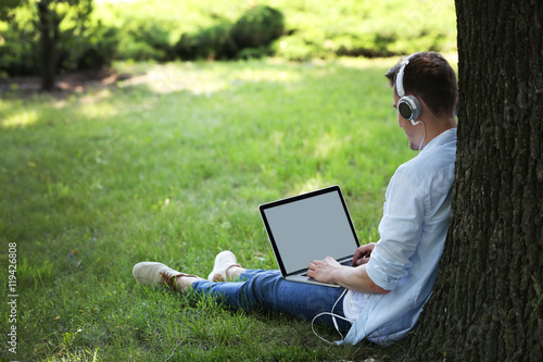 Handsome man with laptop li...