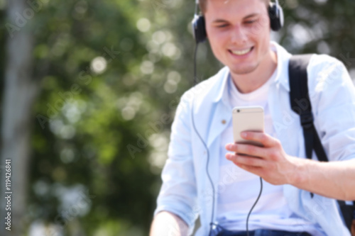 Handsome man listening musi...