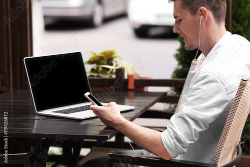 Handsome man with laptop li...