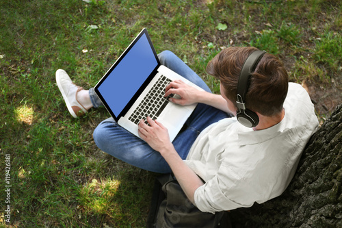 Handsome man with laptop li...