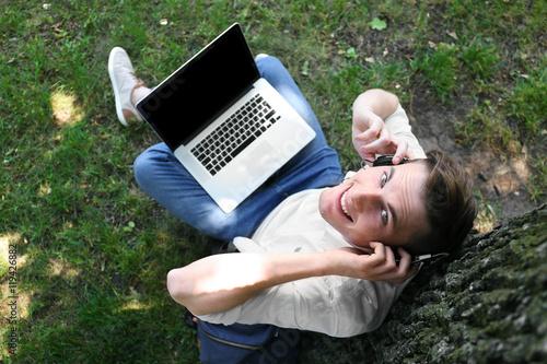 Handsome man with laptop li...