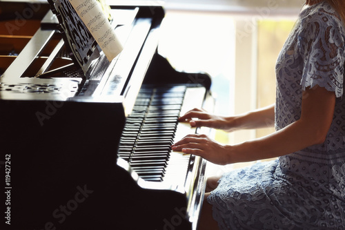 Beautiful woman playing piano
