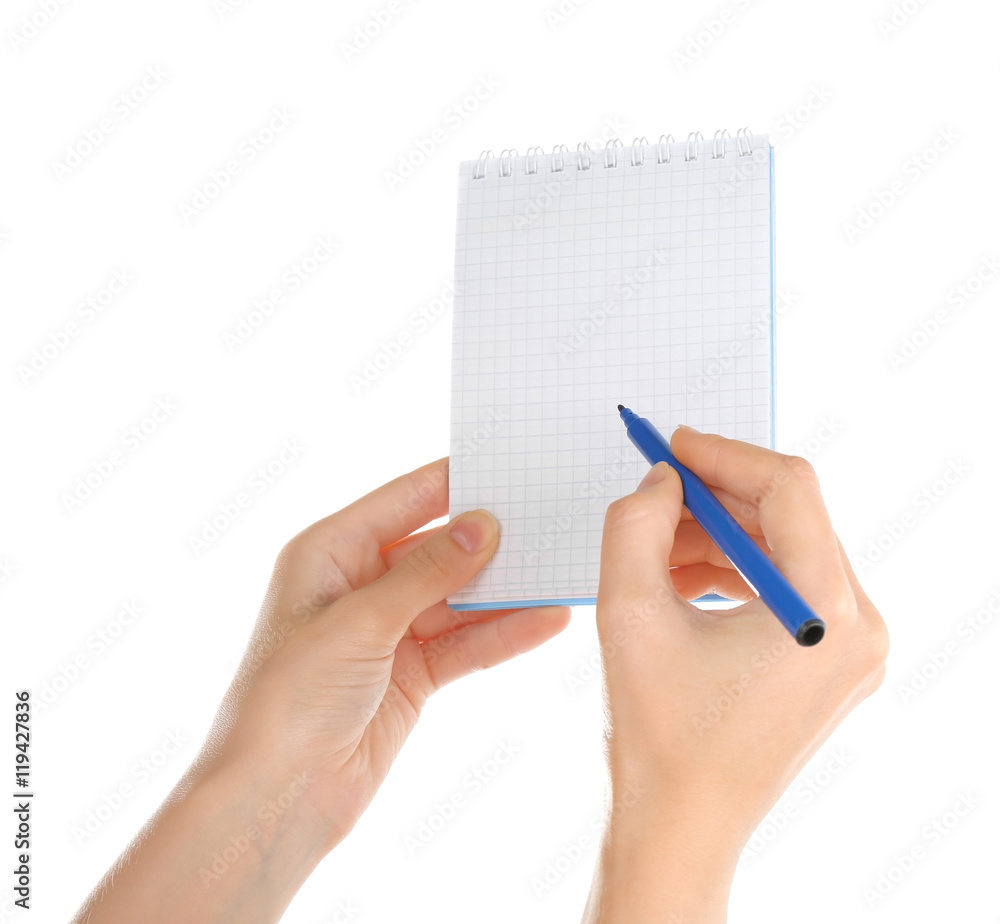 Hand holding notepad and pen on white background Hand holding notepad and pen on white background