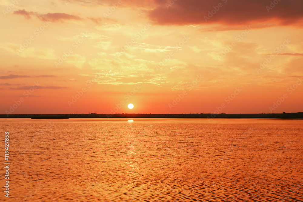 Beautiful sunset sky above sea water Beautiful sunset sky above sea water