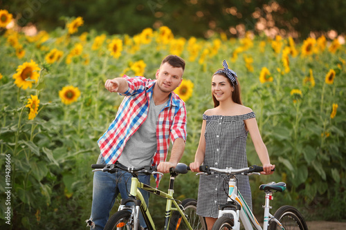 Young couple on bicycles in...