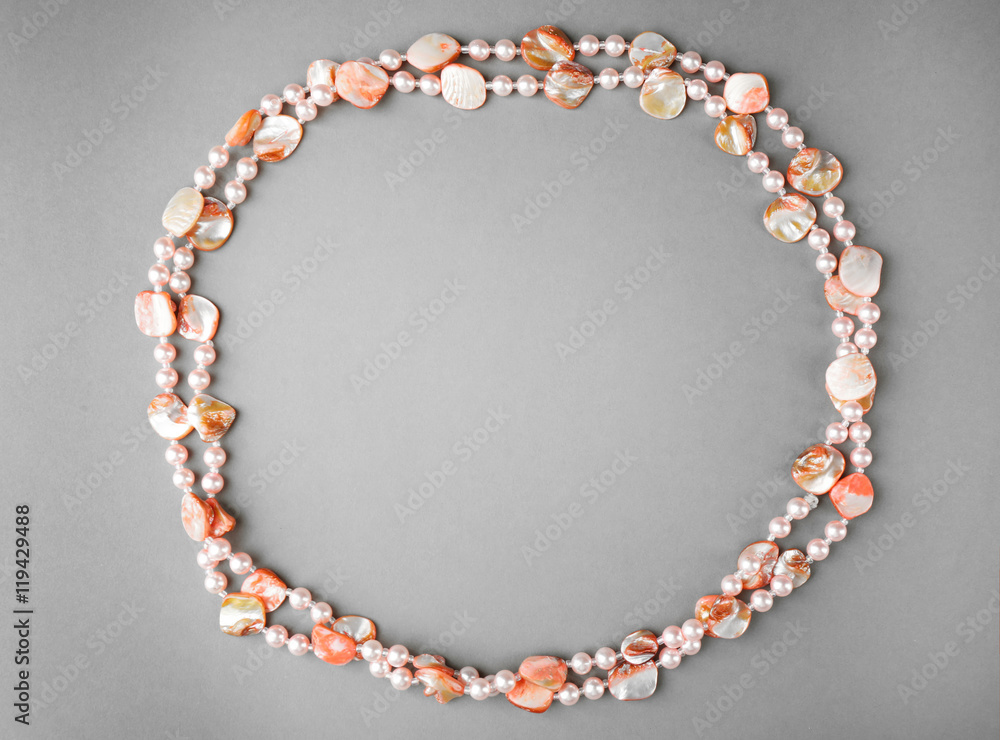Stylish beads on grey background Stylish beads on grey background