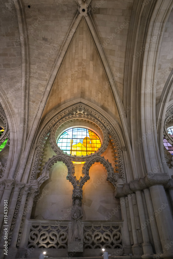 Detail of stained glass window and Nave Ceiling in the interior of cathrdral of Cuenca, Spain